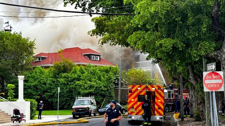 Miami Fire Rescue and Miami police work at the scene...