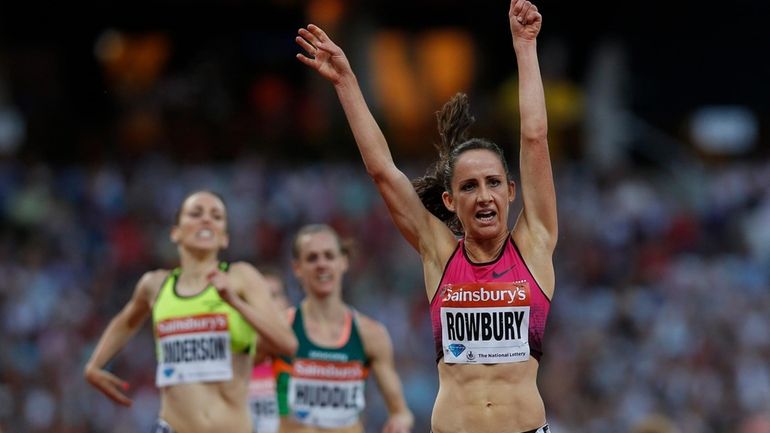 Shannon Rowbury of the United States, right, celebrates her win...