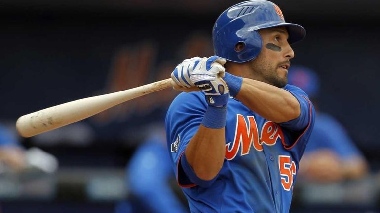 Andres Torres hits a three-run triple during the fourth inning...