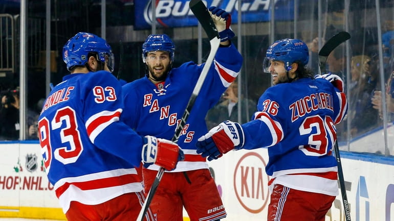 Mats Zuccarello, right, of the Rangers celebrates his first-period goal...