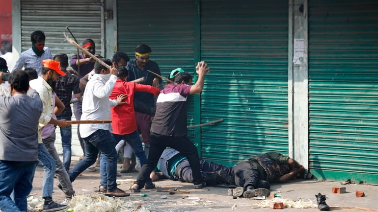 Activists of the Bangladesh Nationalist Party attack security officers during...