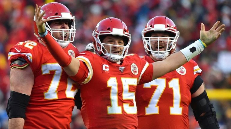 The Chiefs' Patrick Mahomes celebrates a touchdown pass with Eric...