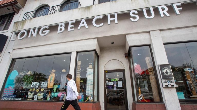 Browse the shelves at Long Beach Surf shop.