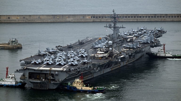The Theodore Roosevelt (CVN 71), a nuclear-powered aircraft carrier is...