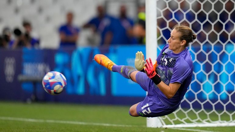 Germany goalkeeper Ann-Katrin Berger saves a penalty shoot-out during a...