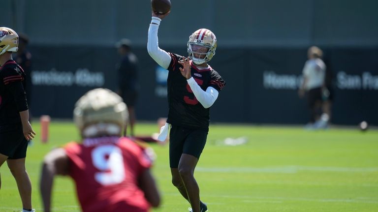 San Francisco 49ers quarterback Joshua Dobbs throws a pass to...