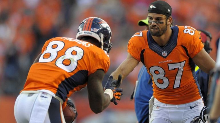 Denver Broncos wide receiver Eric Decker congratulates wide receiver Demaryius...