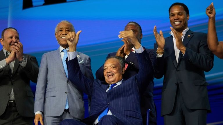 Rev. Jesse Jackson gestures during the Democratic National Convention Monday,...