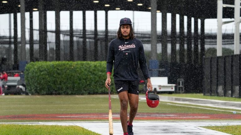 Washington Nationals' James Wood heads to the clubhouse in a...