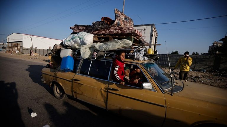 Palestinians flee the Israeli ground offensive in Khan Younis, Gaza...