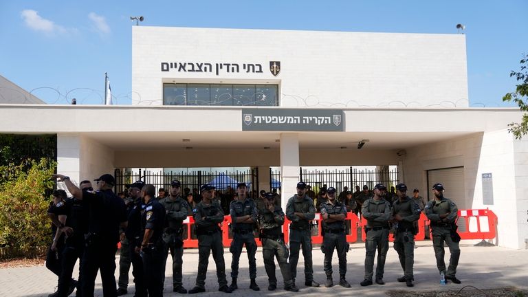 Israeli police stand guard during a right-wing protest outside of...