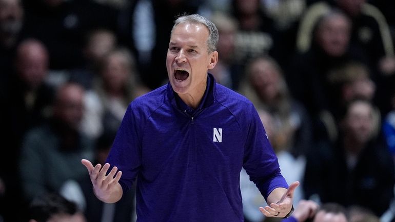 Northwestern Wildcats head coach Chris Collins yells to his team...