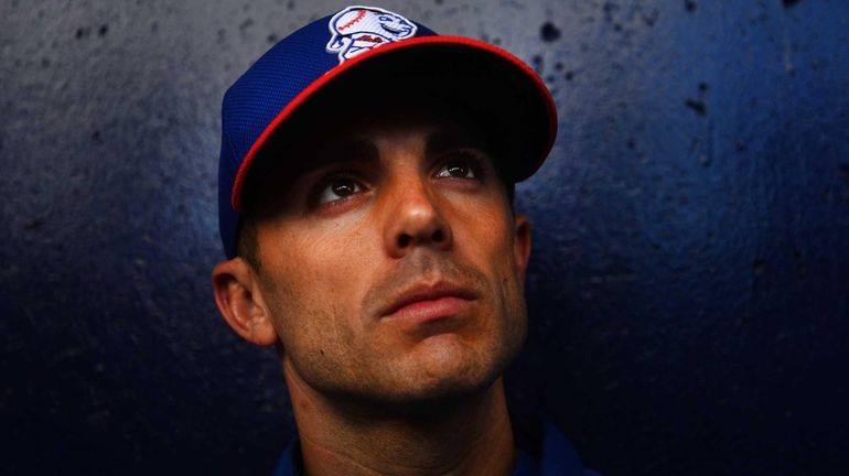 David Wright talks to the media after a spring training...