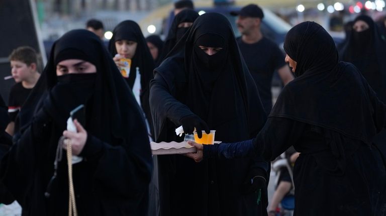 Shiite pilgrims march to Karbala for the Arbaeen ritual, the...