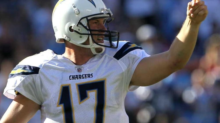 Quarterback Philip Rivers #17 of the San Diego Chargers signals...