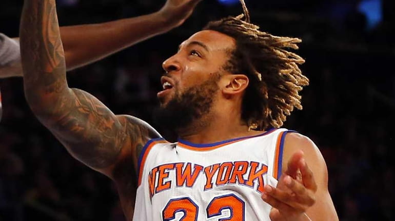 Derrick Williams #23 of the New York Knicks drives to...