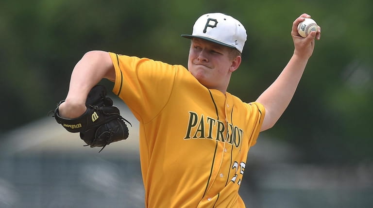 Ryan Hynes of Ward Melville delivers on Saturday, June 1,...