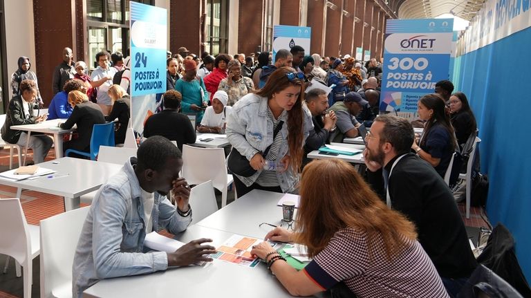 People queue for information or to apply for a job...