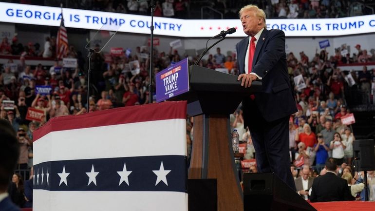 Republican presidential candidate former President Donald Trump speaks at a...