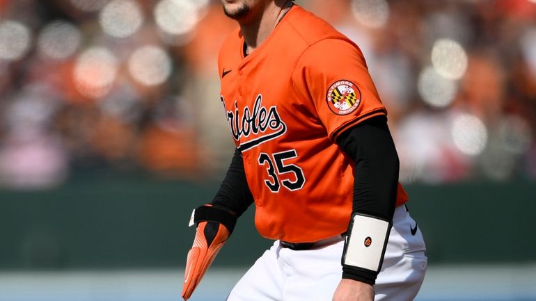 Baltimore Orioles' Adley Rutschman takes a lead from first base...