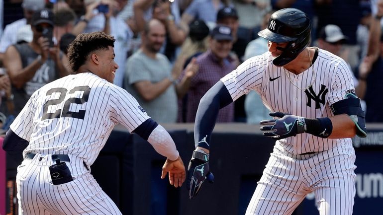 Aaron Judge #99 of the New York Yankees celebrates his...