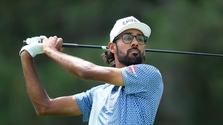 Akshay Bhatia hits off the fourth tee during the first...