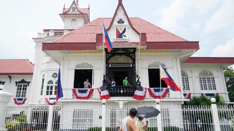 Workers prepare the Emilio Aguinaldo Shrine where Philippine independence from...
