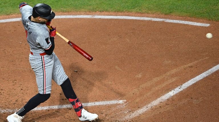 Minnesota Twins shortstop Carlos Correa hits an RBI single during...