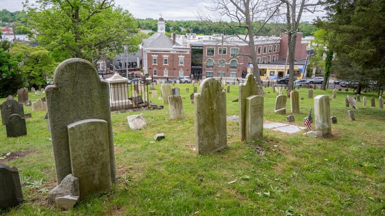 Huntington's oldest cemetery, the Old Burying Ground on Main Street, seen...