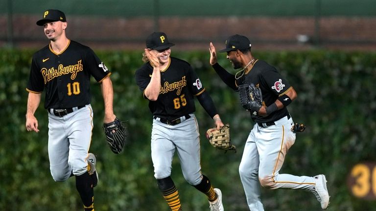 Pittsburgh Pirates right fielder Joshua Palacios, right, center fielder Jack...