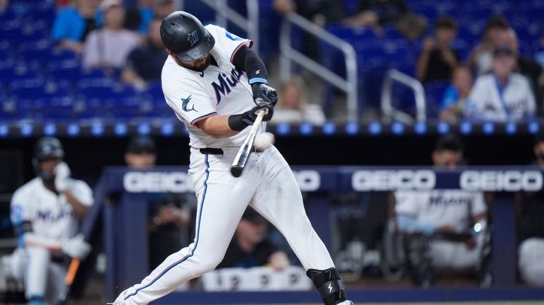 Miami Marlins' Jake Burger hits a home run during the...