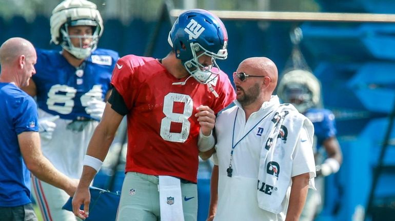 New York Giants quarterback Daniel Jones and head coach Brian...