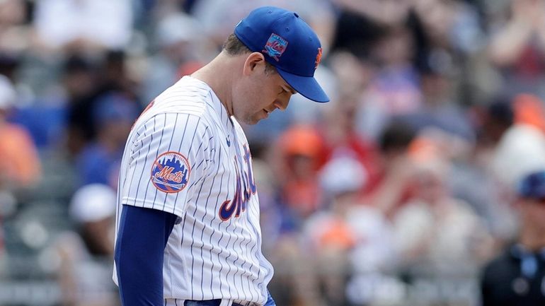 Adam Ottavino of the Mets reacts after surrendering a ninth-inning home...