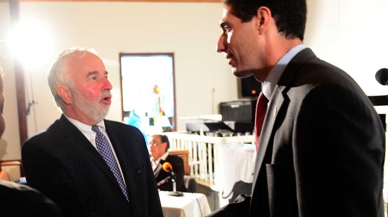 Congressman Tim Bishop shakes hands with opponent, congressional candidate Randy...