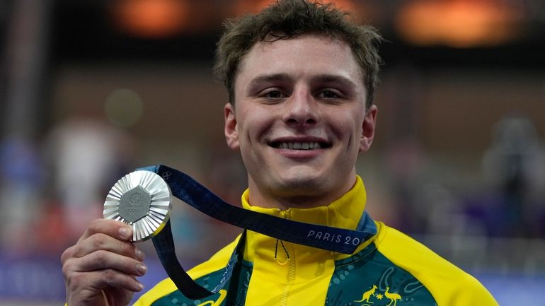 Matthew Richardson of Australia shows the silver medal of the...