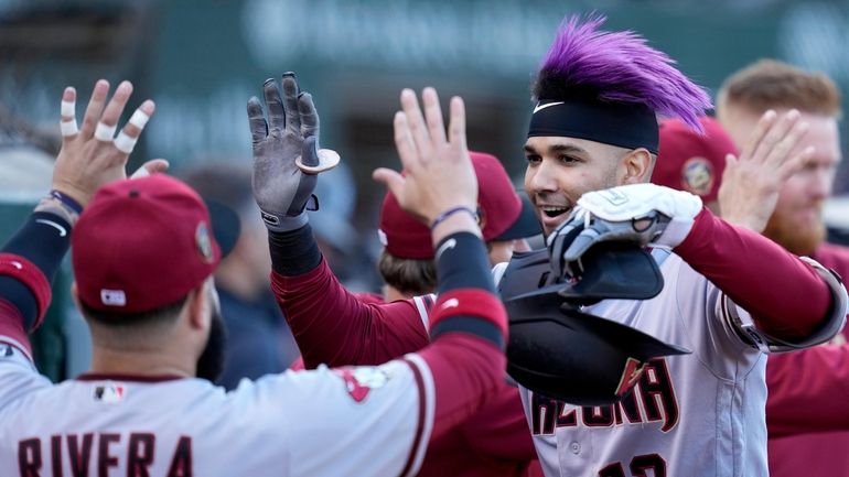 Arizona Diamondbacks' Lourdes Gurriel Jr. walks to the dugout