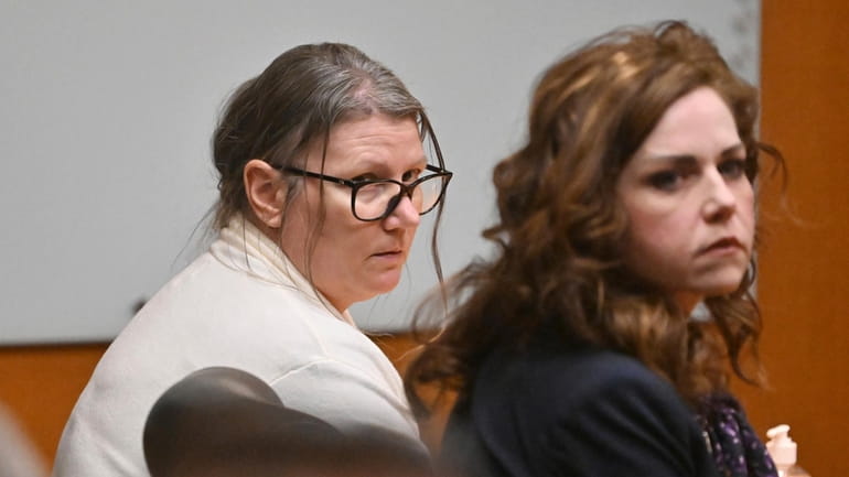 Defendant Jennifer Crumbley, left, and her attorney Shannon Smith react...