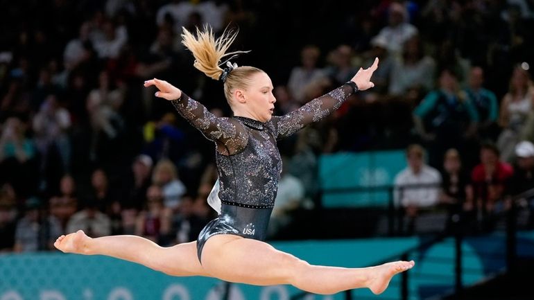 Jade Carey, of United States, competes on the floor exercise...