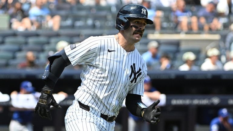 Yankees catcher Austin Wells runs on his two-run double against...