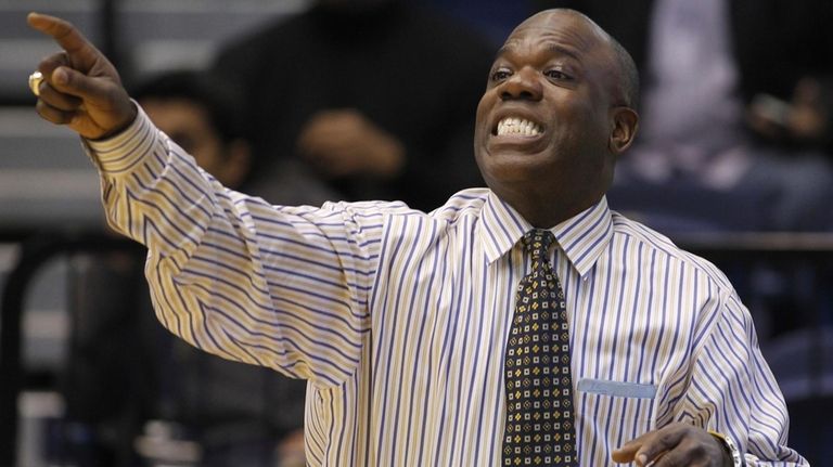 Then-George Washington head coach Karl Hobbs gestures during the first...