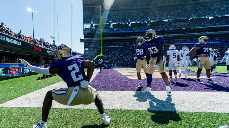 Washington wide receiver Ja'Lynn Polk (2) celebrates after a touchdown...