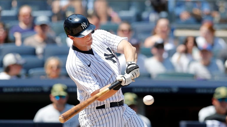 DJ LeMahieu #26 of the Yankees connects on a second inning...