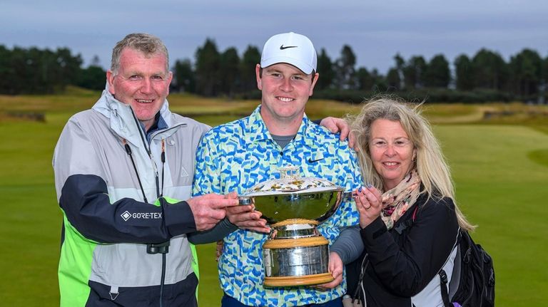 Robert MacIntyre with his parents Dougie and Carol MacIntyre after...