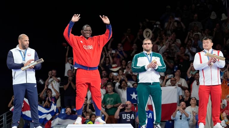 Medalists, from left, Chile's Yasmani Acosta Fernandez, silver, Cuba's Mijain...