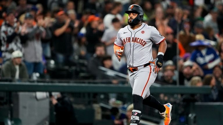 San Francisco Giants' Heliot Ramos jogs the bases after hitting...