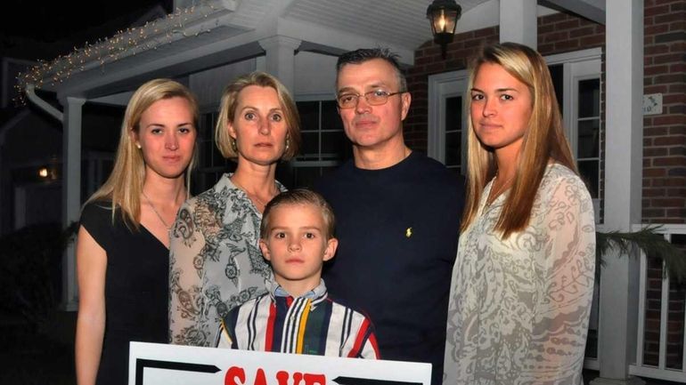 Susan Carroll, center, with husband Jim, son John, daughter Patricia,...