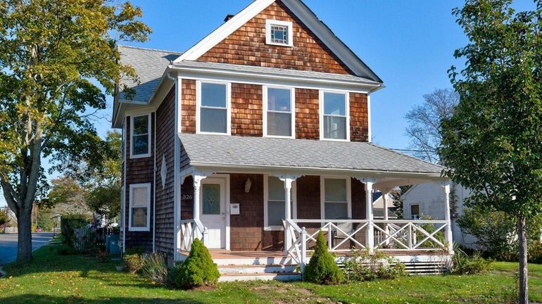 The circa-1920 residence in Greenport, which was overhauled around 2006,...