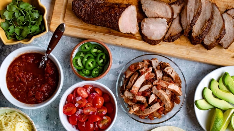 Spice-rubbed pork tenderloin roast becomes a second meal of tacos.
