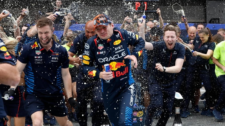 Red Bull driver Max Verstappen of the Netherlands celebrates with...