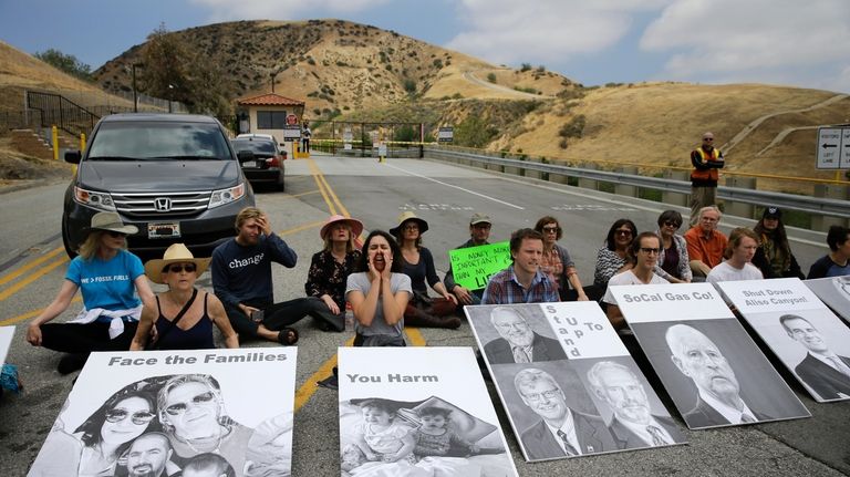 People chant slogans during a protest outside the Aliso Canyon...